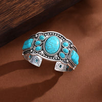 Gouden oorbellen met turquoise druppelsteen