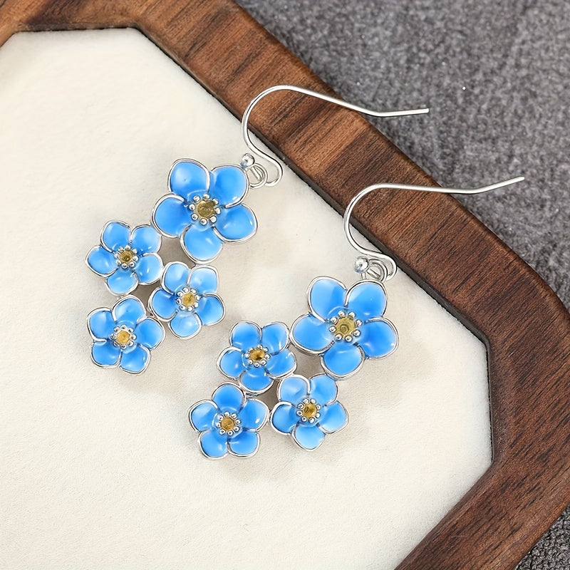 Zilveren oorbellen met blauwe emaille bloemen