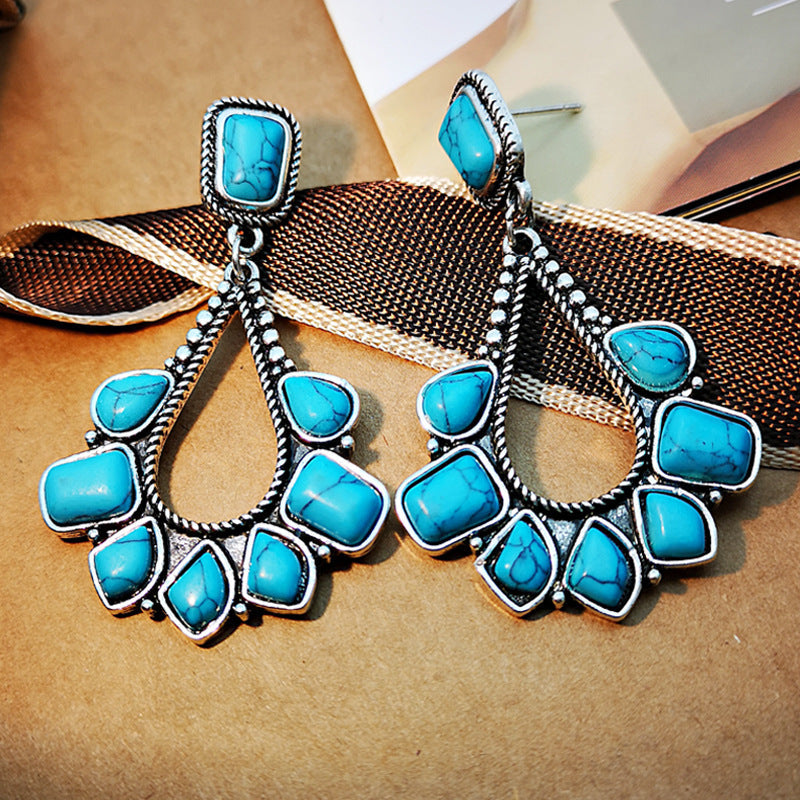Zilveren bohemian oorbellen met turquoise waaier