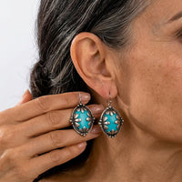 Zilveren ovale oorbellen met turquoise edelsteen