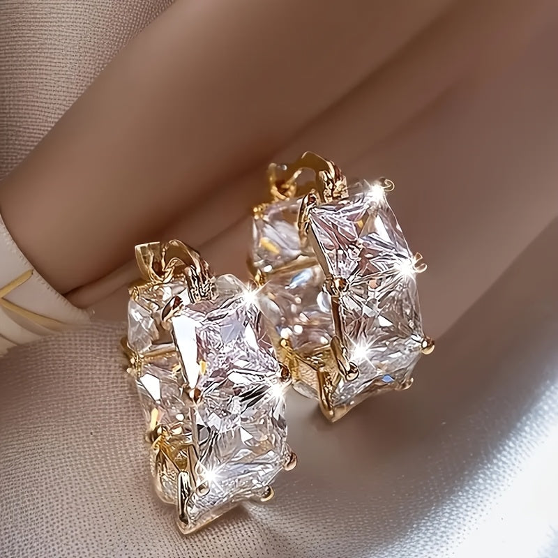 Gouden oorbellen met veelkleurige zirkonia in bloemwervel