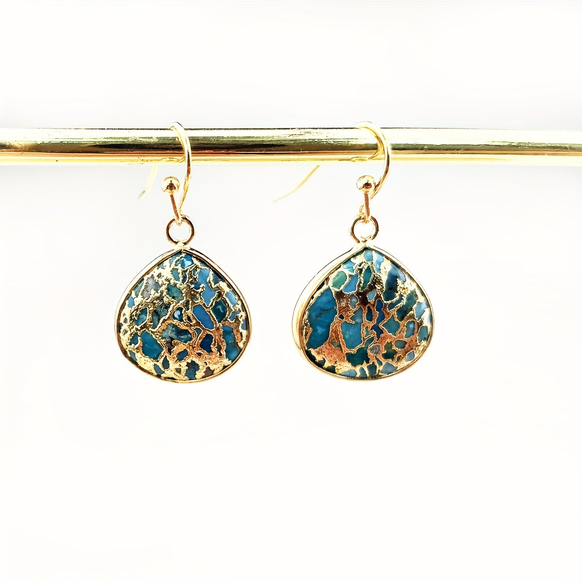 Gouden bohemian druppeloorbellen met turquoise mozaïek