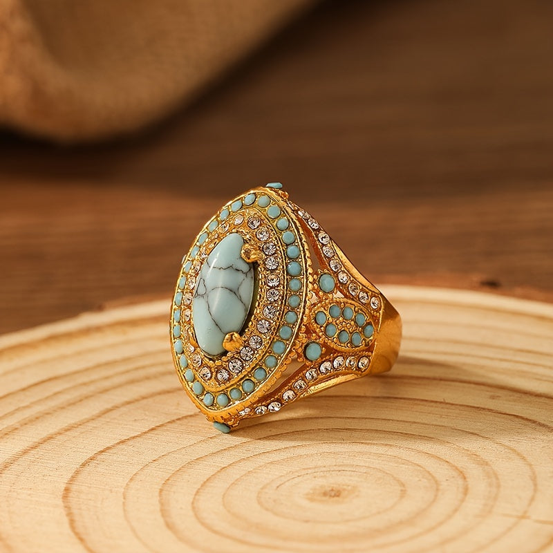 Gouden vintage ring met turquoise ovaal en strass