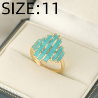 Gouden ring met turquoise geëmailleerde strepen