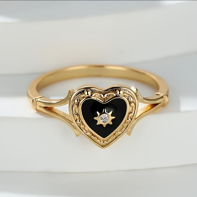 Gouden ring met zwart geëmailleerd hart en zonnetje