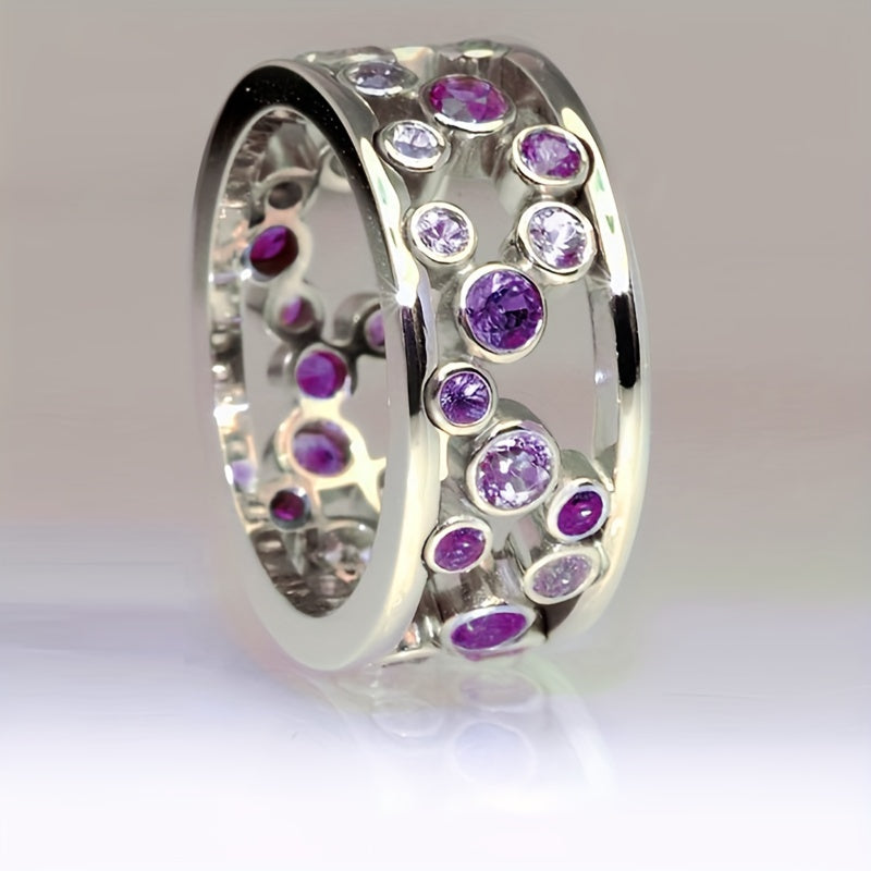 Brede zilveren ring met blauwe en witte zirkonia