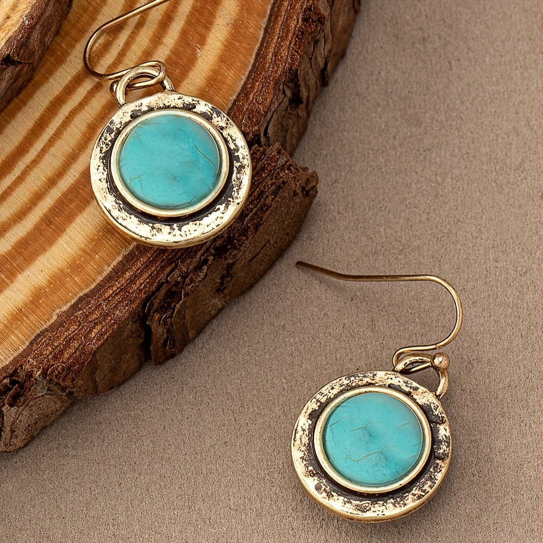 Goudkleurige vintage oorbellen met ronde turquoise