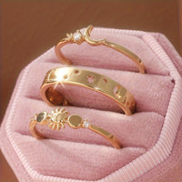 Gouden ringenset met zon, maan en sterren