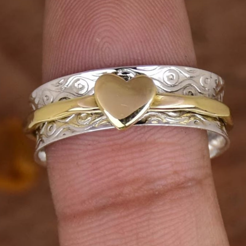 Zilveren gouden draairing met hart
