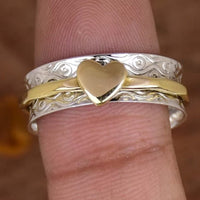 Zilveren spinner ring met gouden hart