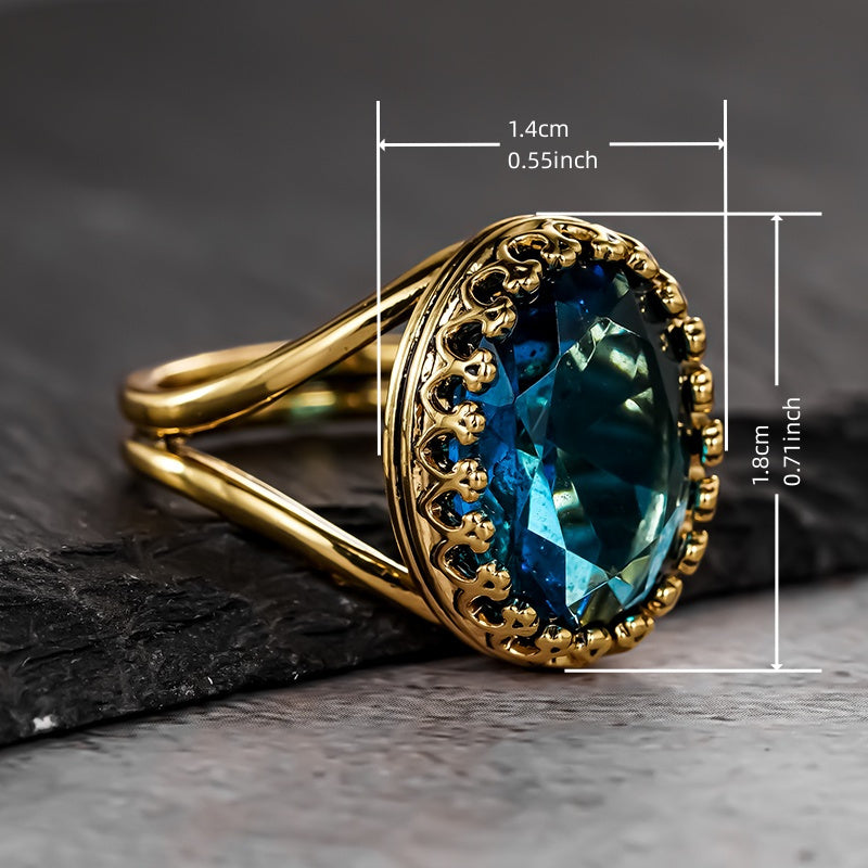 Gouden vintage ring met ovale blauwe edelsteen in kroonzetting
