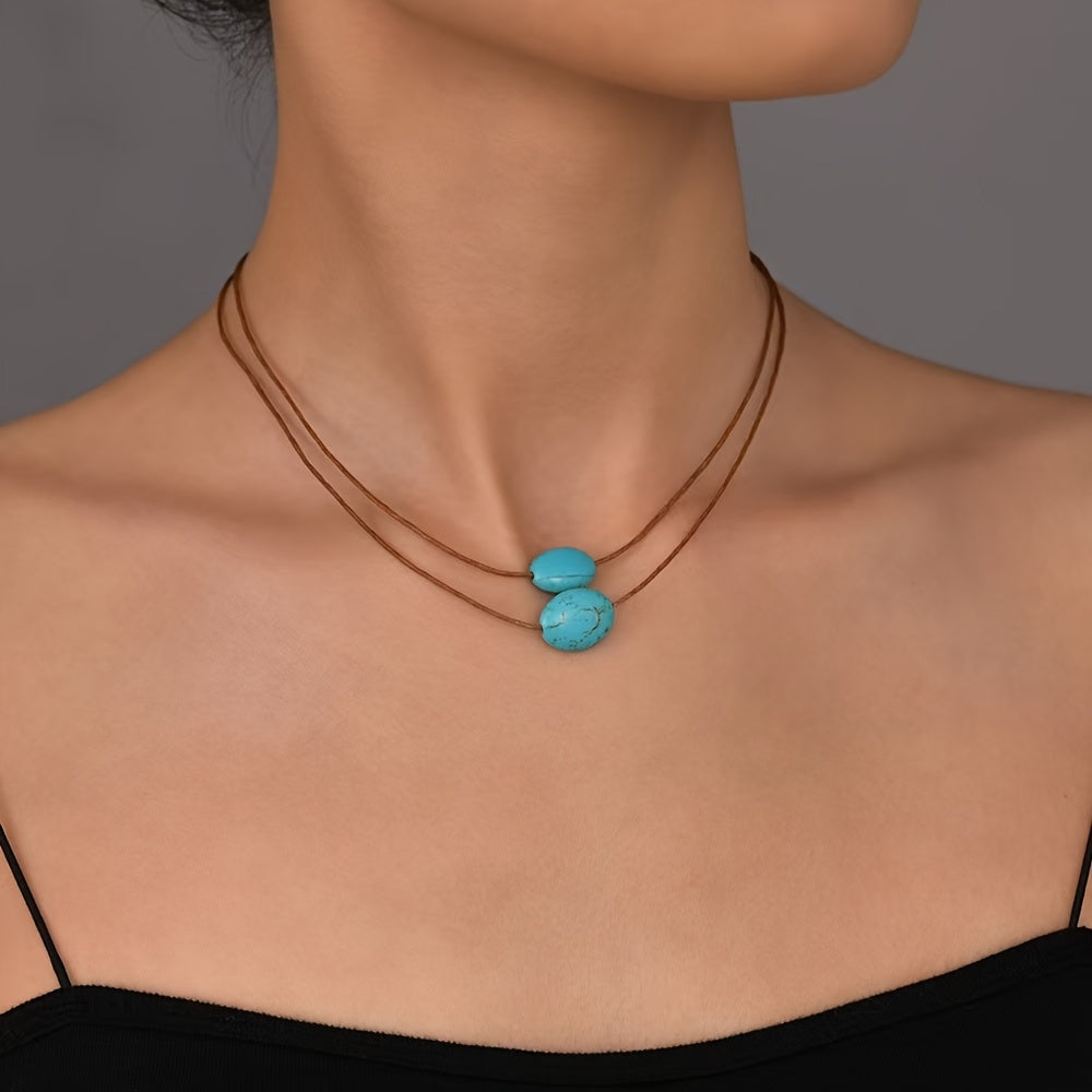 Bohemian ketting met turkooizen hanger en zilveren kwastjes