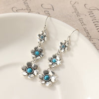 Zilveren bohemian bloemenoorbellen met turquoise