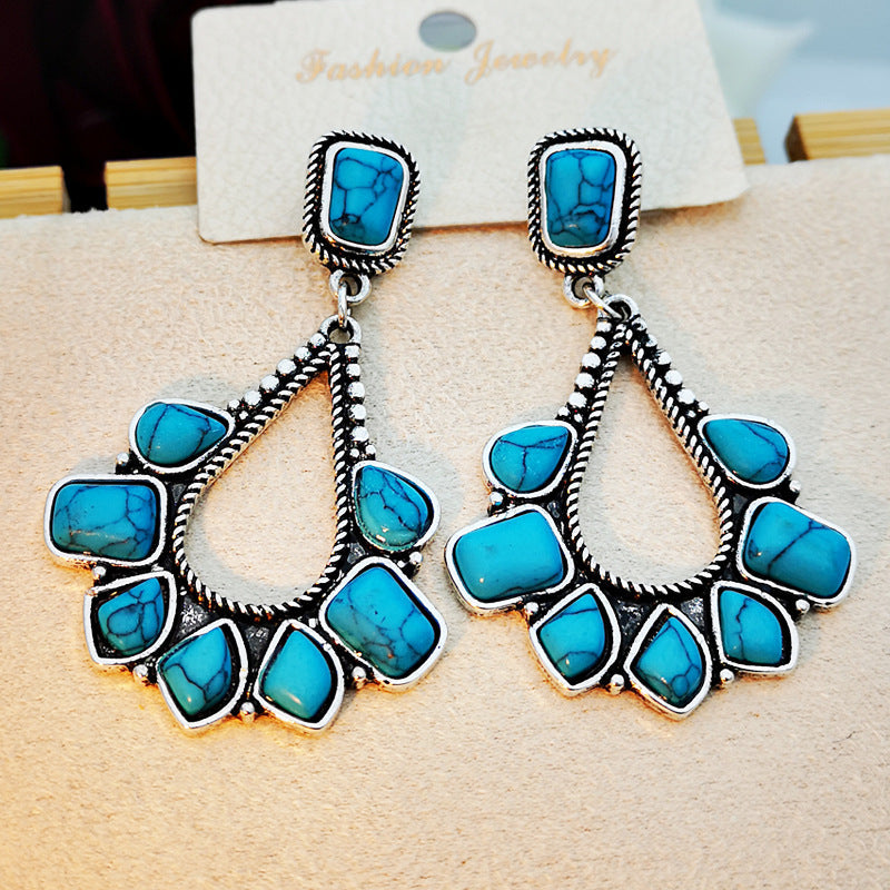 Zilveren bohemian oorbellen met turquoise waaier