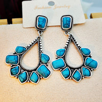Zilveren bohemian oorbellen met turquoise waaier