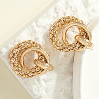Gouden statement oorbellen met getextureerd cirkelmotief