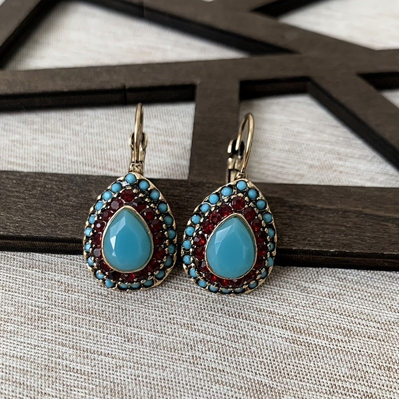 Bohemian bronzen oorbellen met turkoois en rode strass