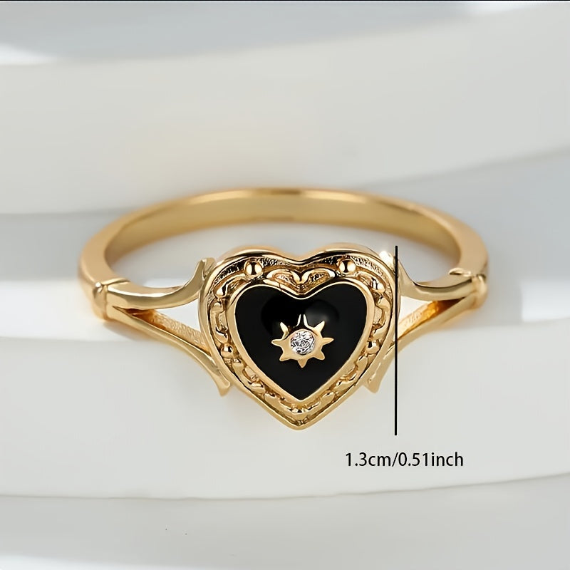 Gouden ring met zwart geëmailleerd hart en zonnetje