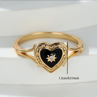 Gouden ring met zwart geëmailleerd hart en zonnetje