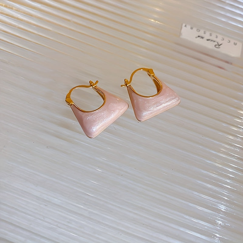Gouden oorbellen met parelmoer handtasje