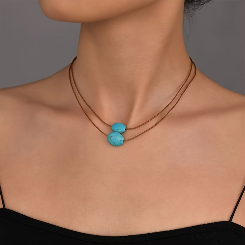 Bohemian ketting met turkooizen hanger en zilveren kwastjes