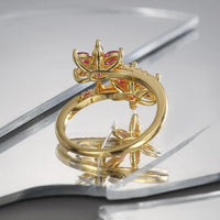 Gouden ring met twee roze zirkonia bloemen