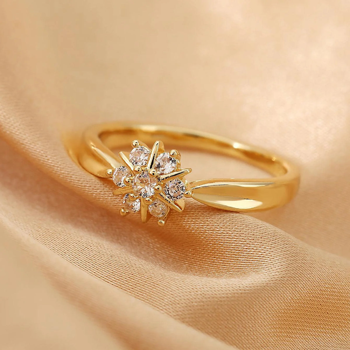 Gouden ring met zirkonia bloem en ster