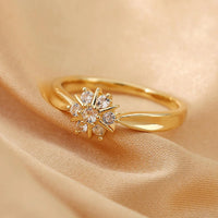 Gouden ring met zirkonia bloem en ster