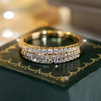 Gouden ring met drie rijen zirkonia
