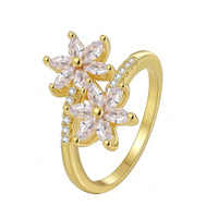 Gouden ring met twee roze zirkonia bloemen