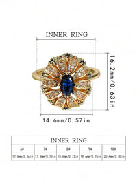Gouden vintage ring met blauwe ovale steen en zirkonia