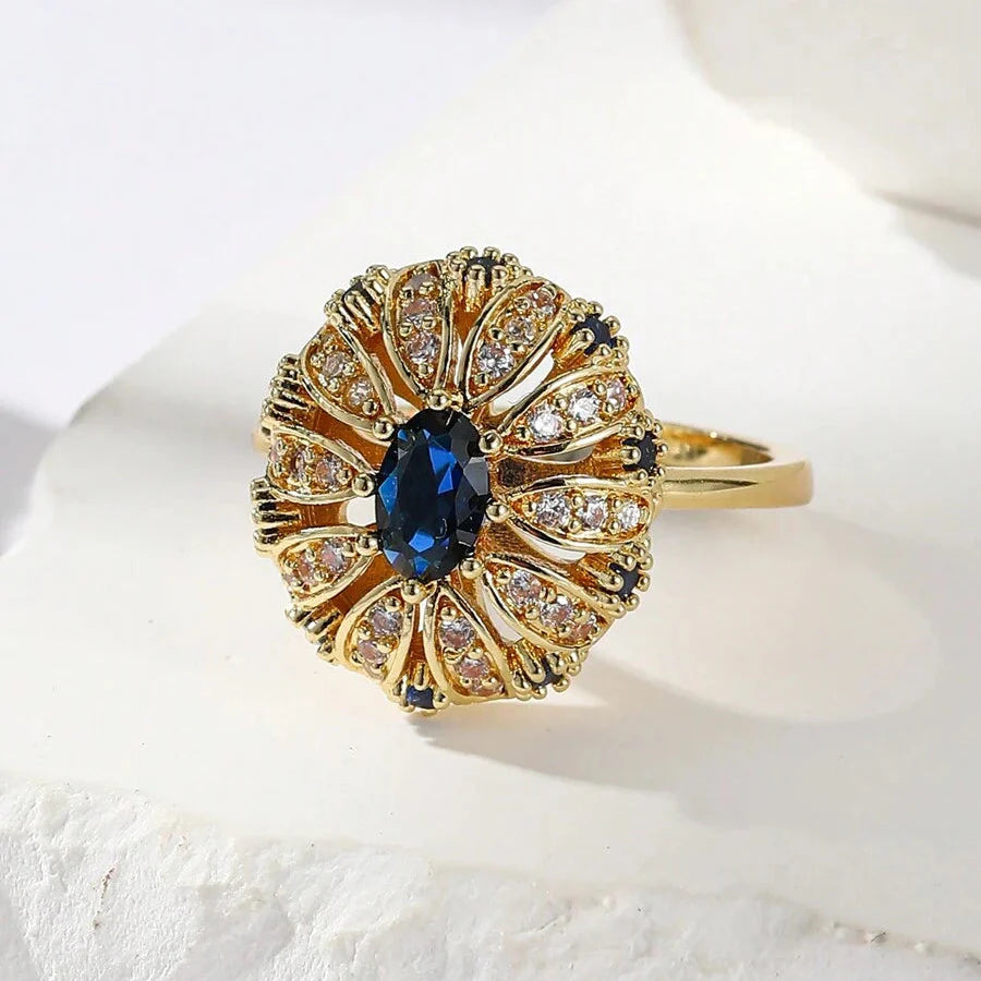 Gouden vintage ring met blauwe ovale steen en zirkonia