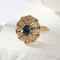 Gouden vintage ring met blauwe ovale steen en zirkonia