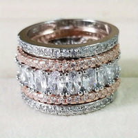 Brede tweekleurige eternityring met ovale zirkonia