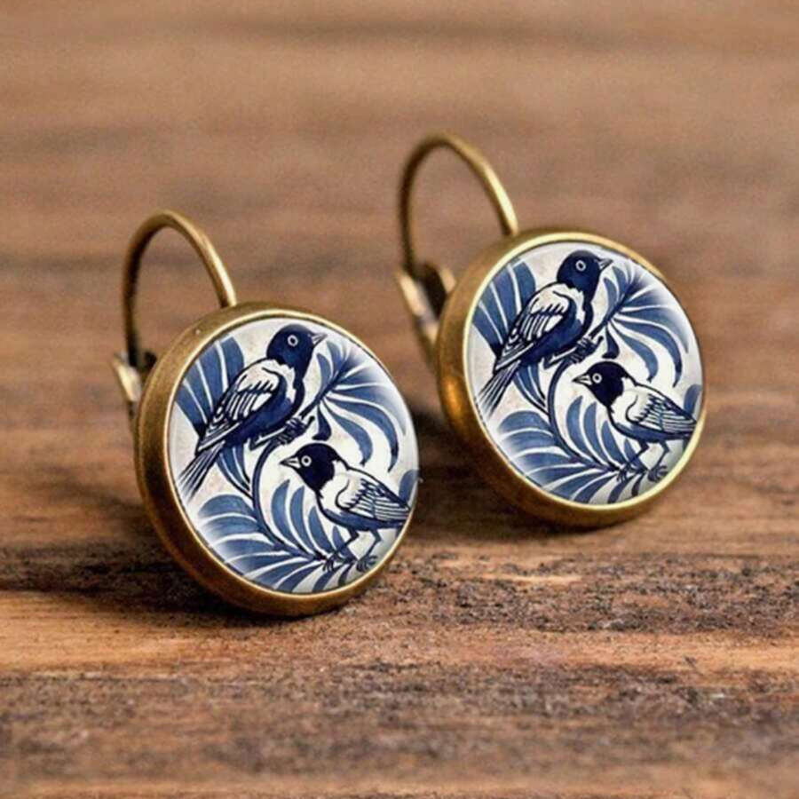 Vintage oorbellen met blauwe vogel in Delfts motief