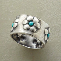 Zilveren brede ring met bloemen en turkoois