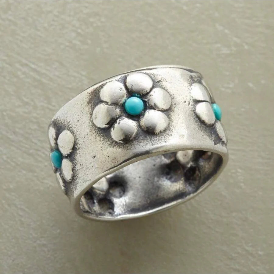 Zilveren brede ring met bloemen en turkoois