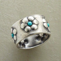 Zilveren brede ring met bloemen en turkoois