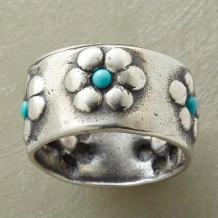 Zilveren brede ring met bloemen en turkoois