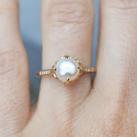Gouden ring met parel en zirkonia accenten