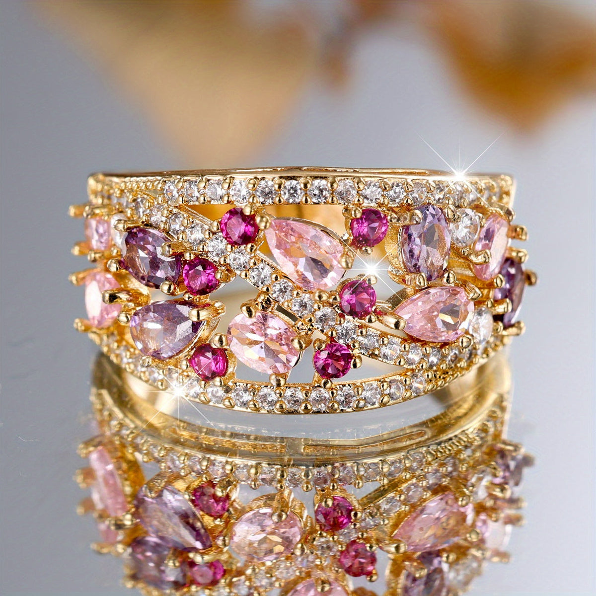 Gouden cocktailring met roze en paarse edelstenen