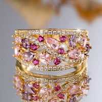 Gouden cocktailring met roze en paarse edelstenen