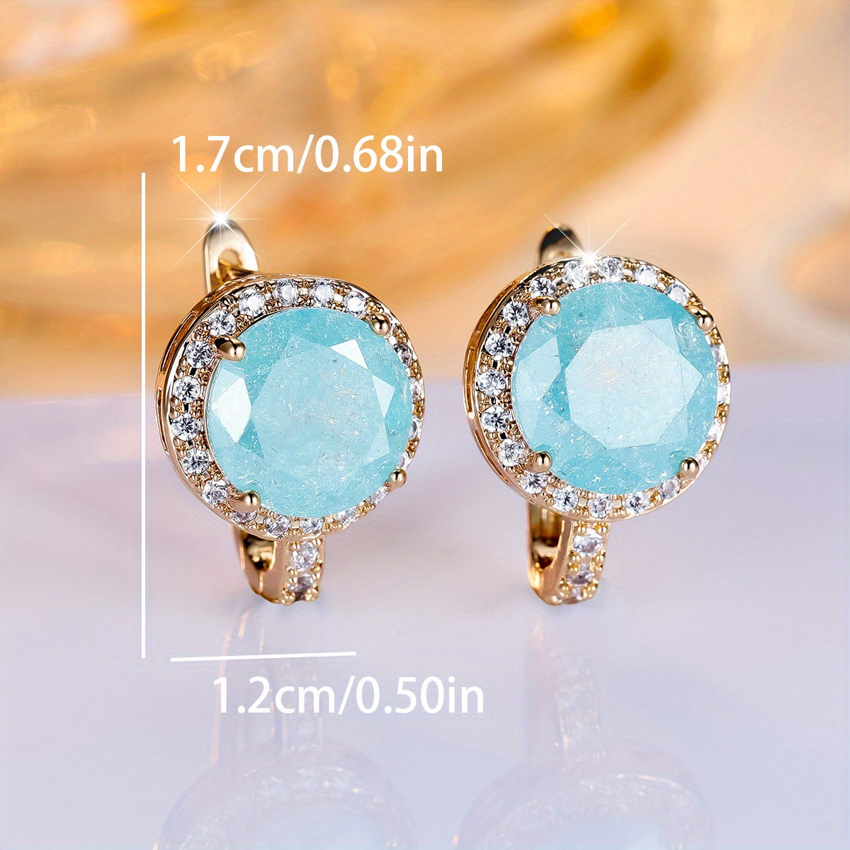 Gouden clip-oorbellen met ronde turquoise steen en zirkonia