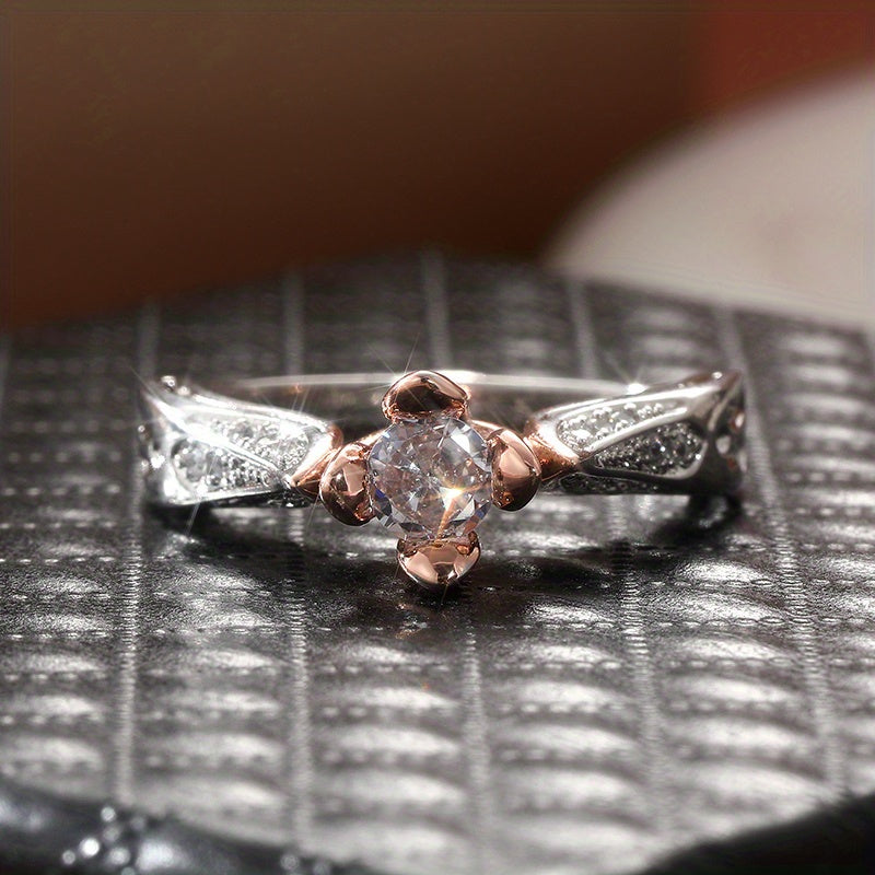 Tweekleurige zilveren en roségouden ring met zirkonia