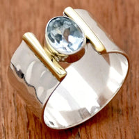 Zilveren ring met goudaccent en heldere edelsteen