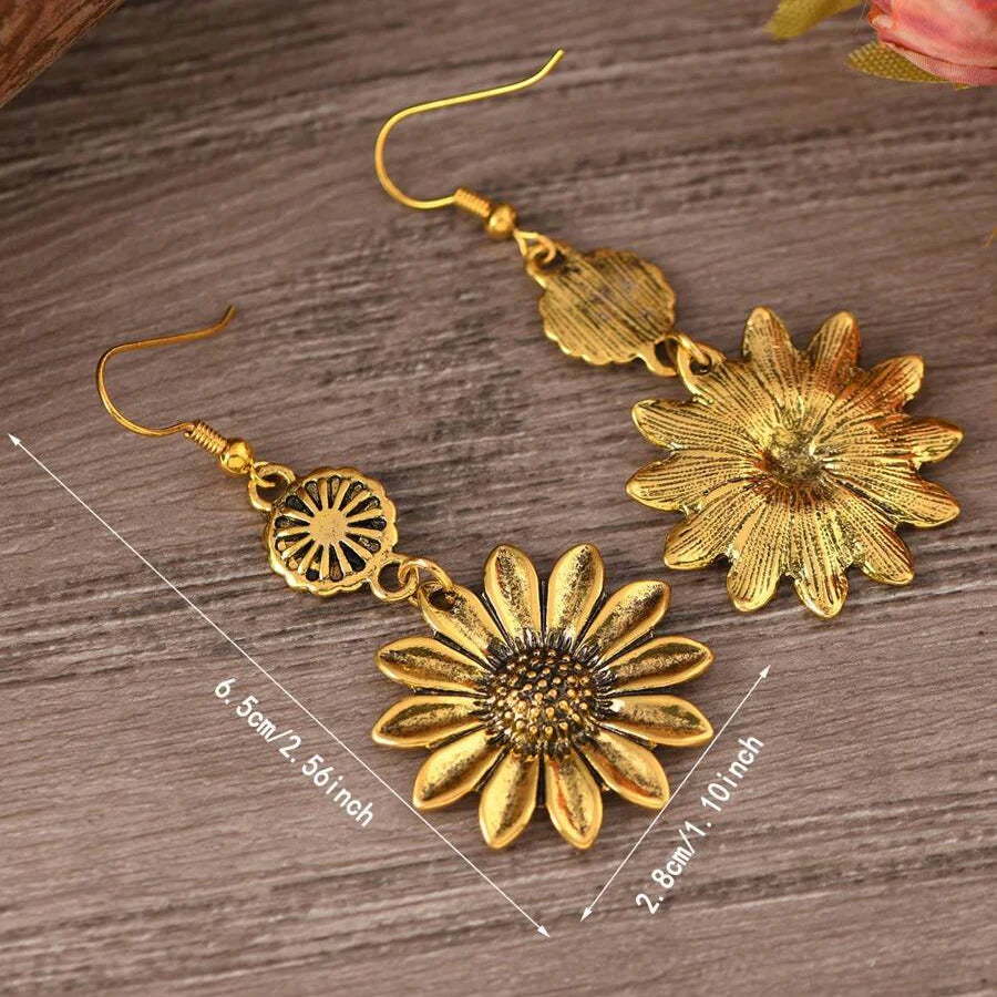 Zilveren bohemian oorbellen met zonnebloem