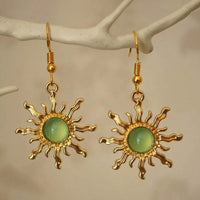 Gouden zonoorbellen met amber cabochon