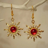 Gouden zonoorbellen met amber cabochon