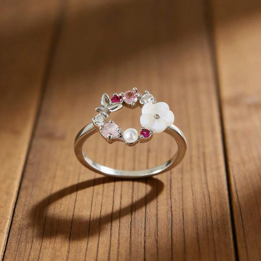 Roségouden ring met bloemkrans, parel en gekleurde zirkonia