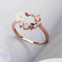 Roségouden ring met bloemkrans, parel en gekleurde zirkonia